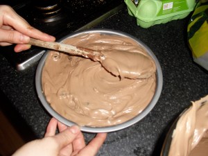 Top the biscuit base with the chocolate mixture